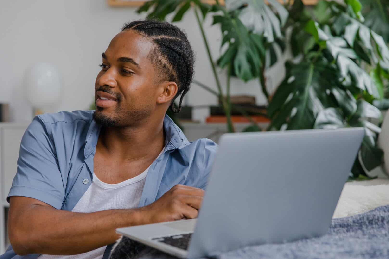 A lady sat in her wheelchair outside. She is sat next to her freind who is looking at the DisabilityPlus website, she is deciding if cerebral palsy counselling is good for her freind.