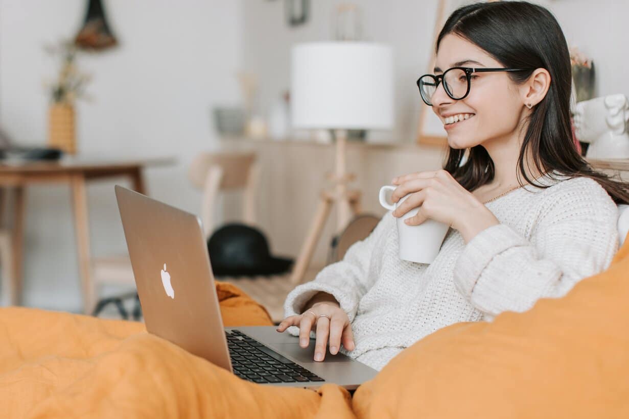 Picture of a lady with a laptop in front of her reading about counselling adults with disabilities