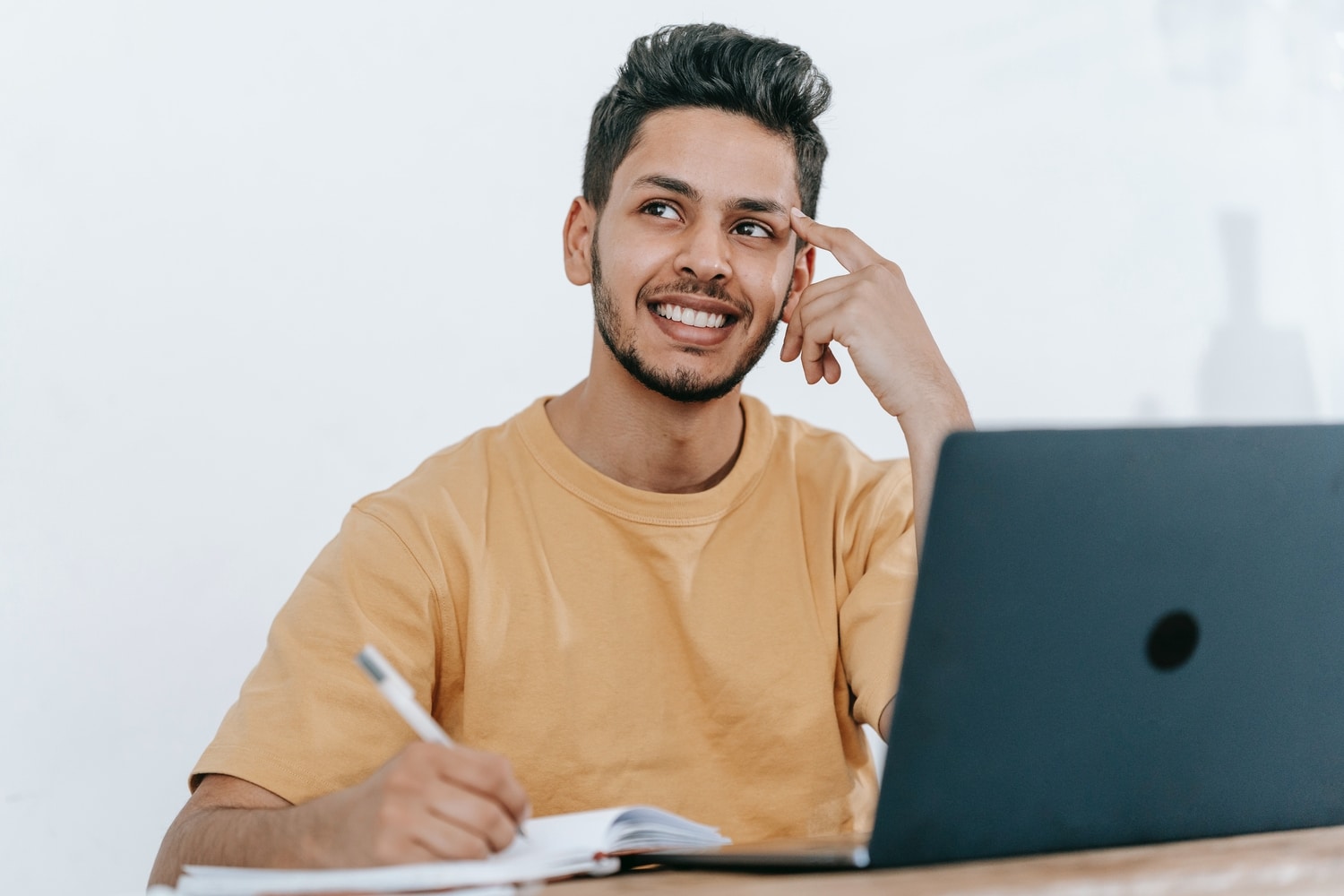 Man sat at his desk contemplating the benefits of counselling adults with Disabilities