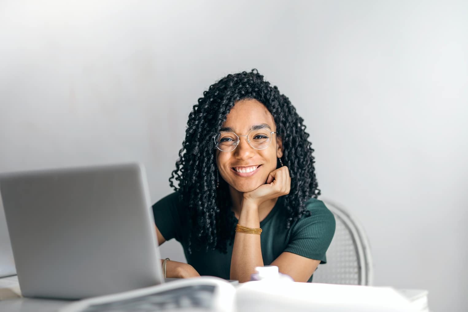 Picture of a lady with a laptop in front of her reading about counselling adults with disabilities