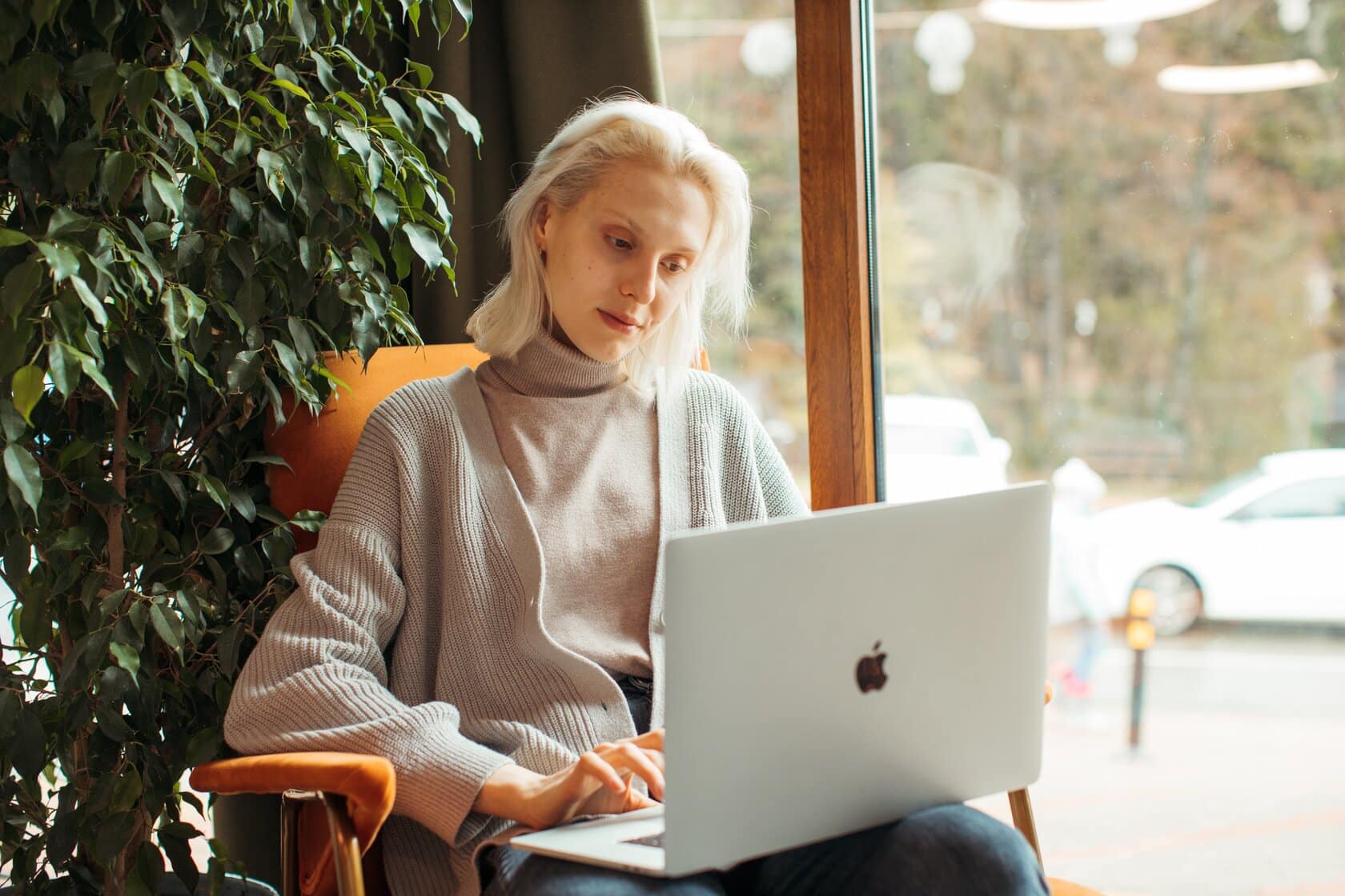 A man sat in his wheelchair with a laptop in front of him. He has had a accident which has resulted to him having spinal cord injury counselling