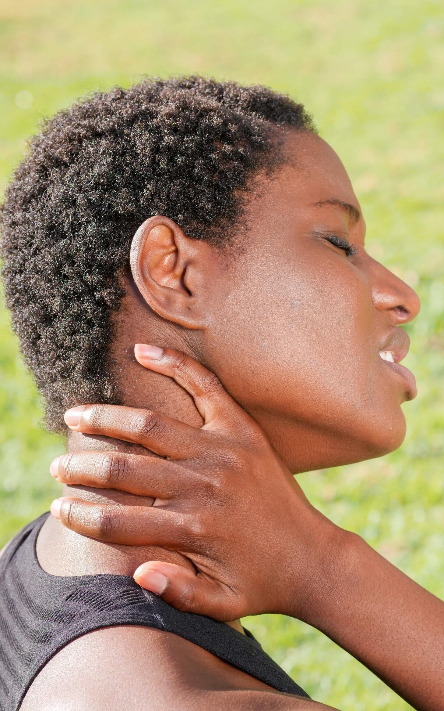 Lady holding her neck, her face indicates she is in pain. She is thinking about personal injury counselling