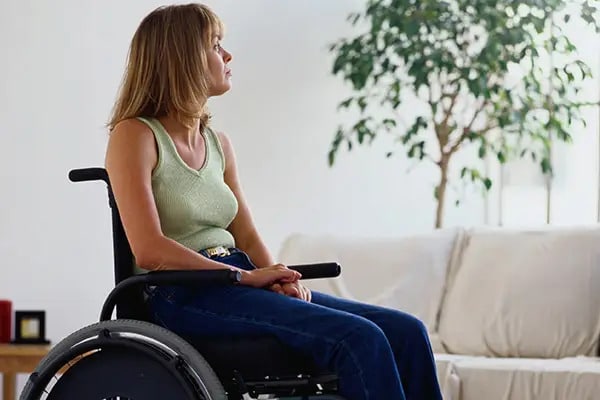 A lady sitting in a wheelchair thinking about what is cerebral palsy mental health