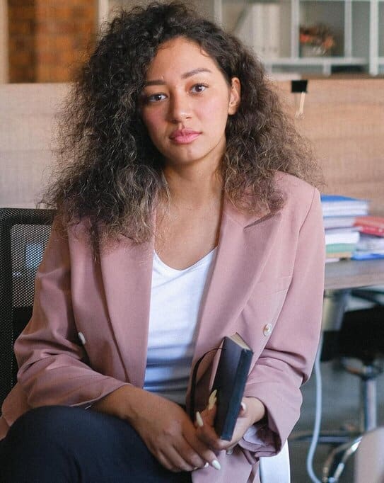 A lady sat down thinking about cerebral palsy and mental health in adults.
